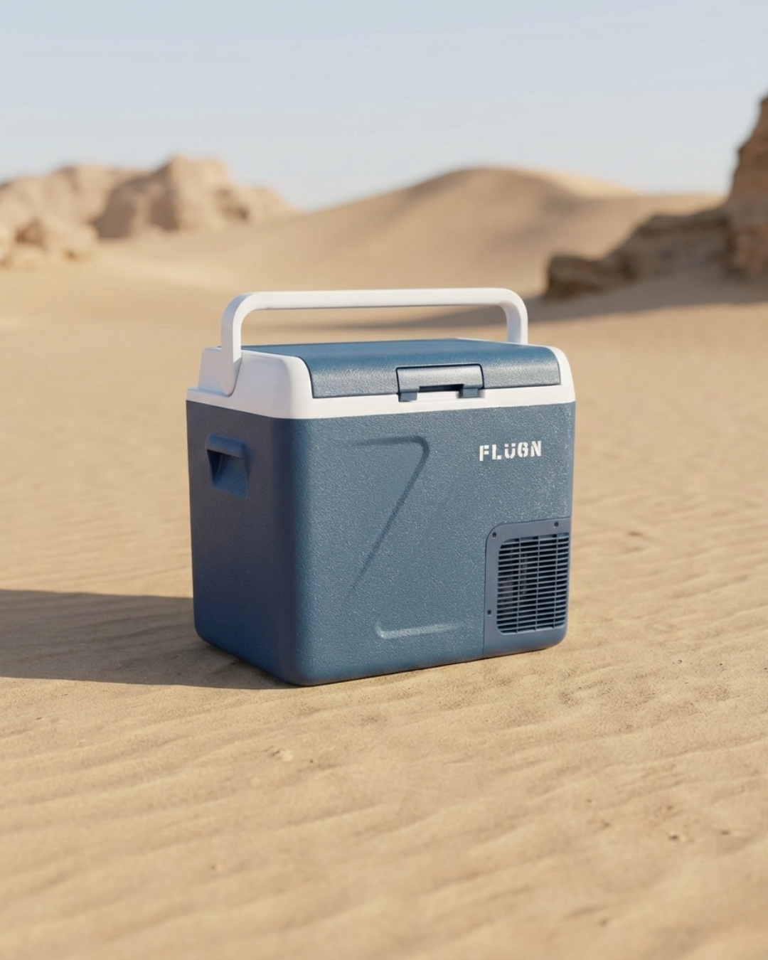 Blue cooler box with 'FLUGN' branding on a sandy desert background